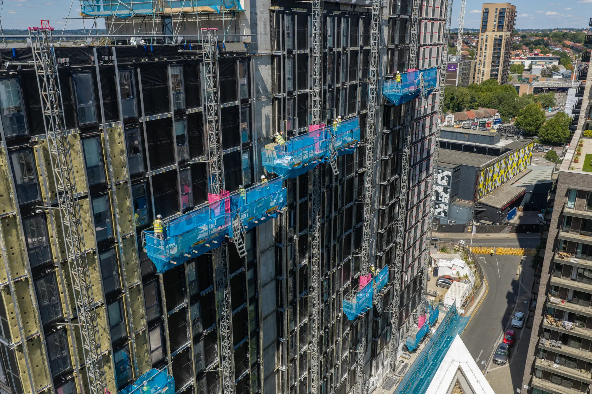 ukr-facades-grand-felda-house-wembley-project-aerial-12 Aerial view of facade installation and external access platforms at Grand Felda House in Wembley
