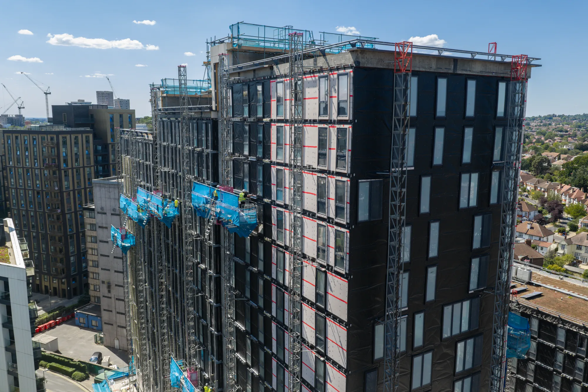 ukr-facades-grand-felda-house-wembley-project-aerial-15 Aerial view of Grand Felda House showing completed and construction-stage sections of the high-rise facade in Wembley