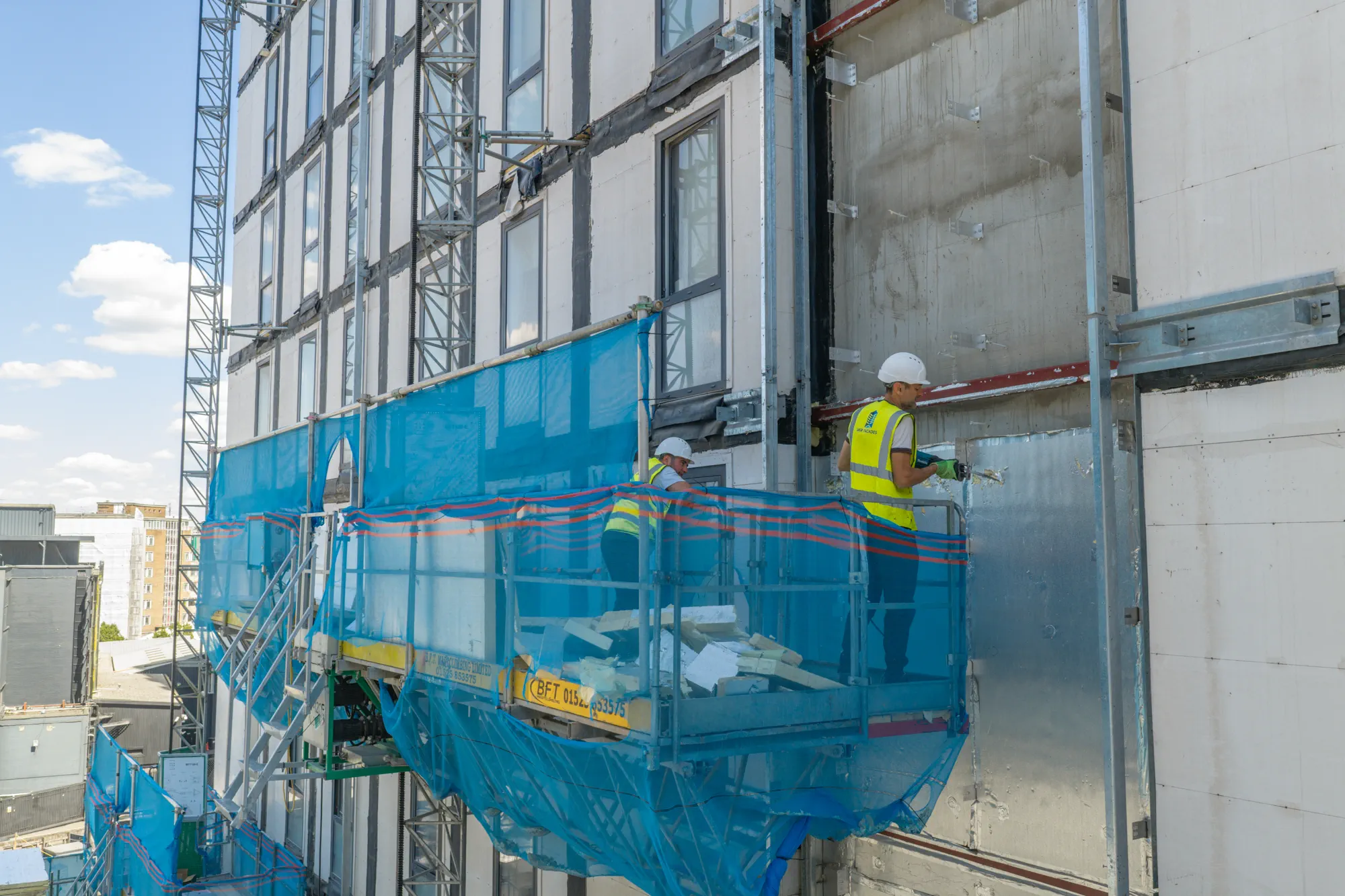 ukr-facades-grand-felda-house-wembley-project-aerial-5 External facade installation underway from access equipment at Grand Felda House in Wembley