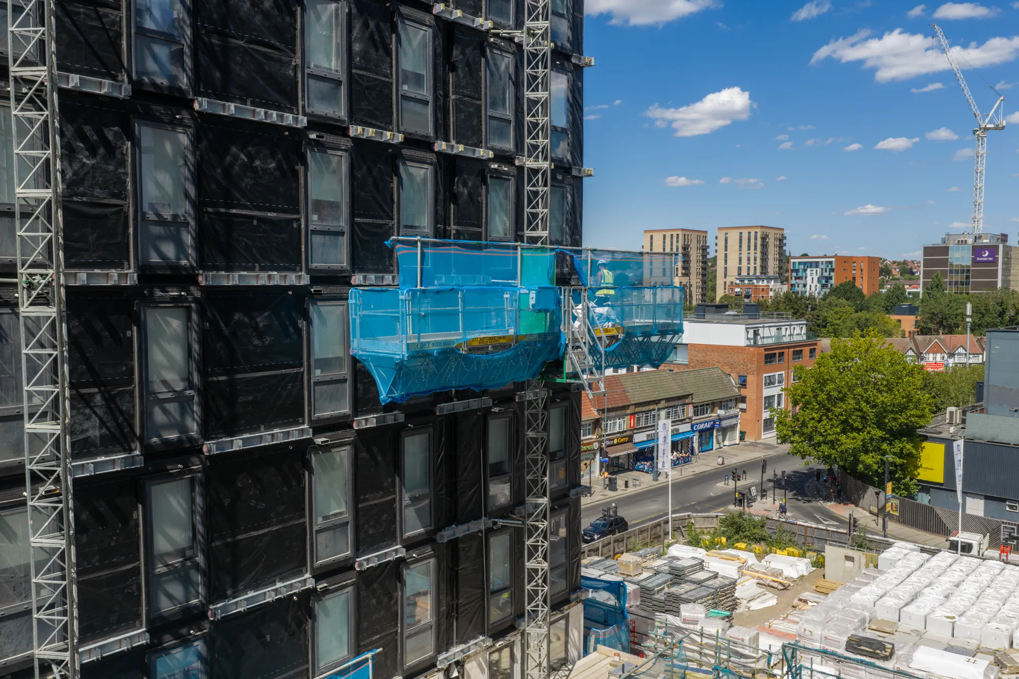 ukr-facades-grand-felda-house-wembley-project-aerial-6 Multi-storey facade construction at Grand Felda House in Wembley showing external access equipment and exposed elevation