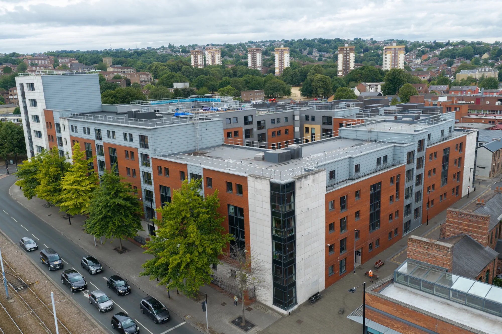 ukr-facades-sheffield-3-sheffield-project-aerial-11 Wide aerial view of the 80 Hoyle Street residential development in Sheffield showing brick and light-coloured external elevations
