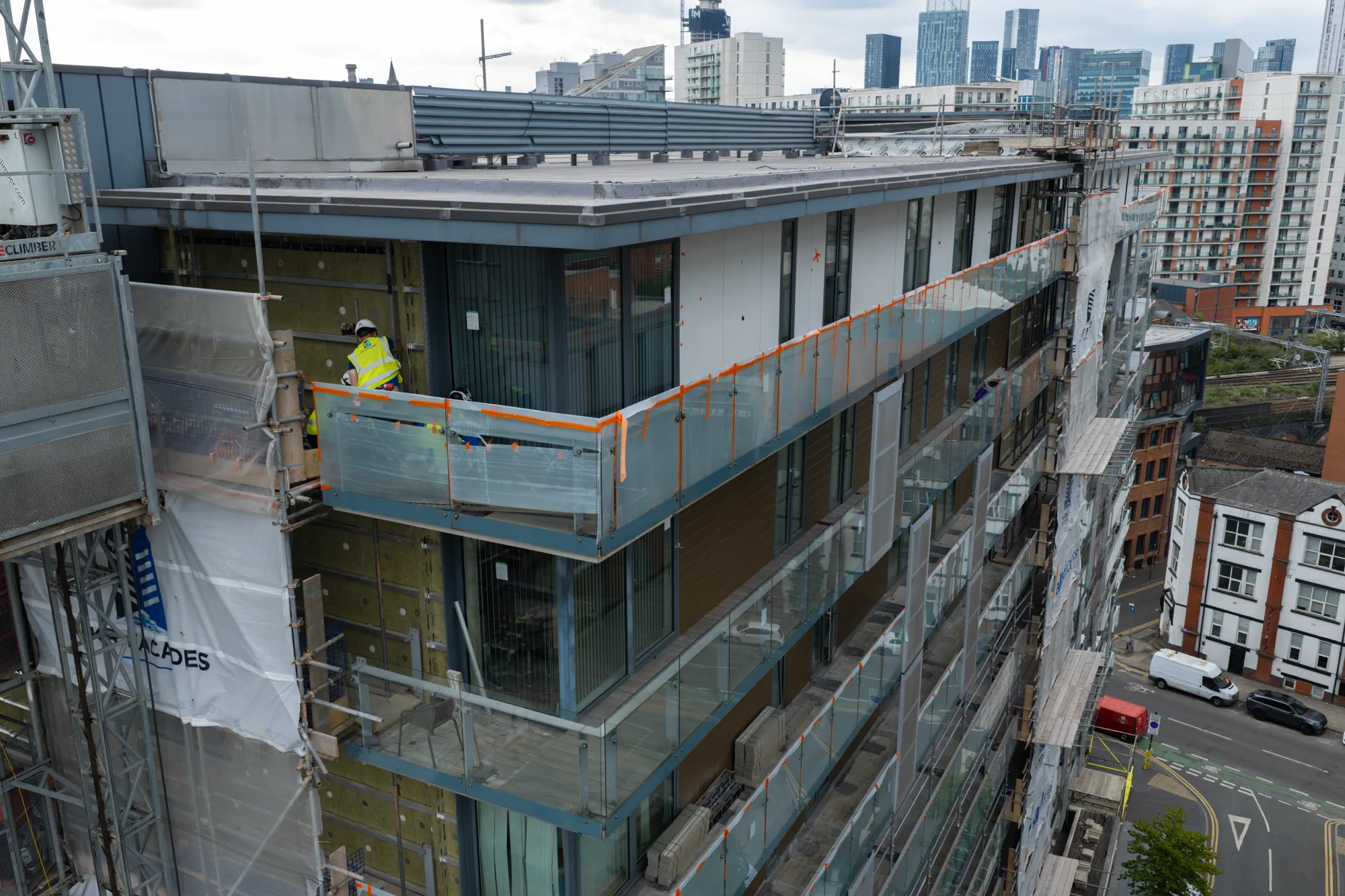 ukr-facades-spectrum-apartments-salford-project-aerial-12 UKR Facades operative working around the upper balcony elevation at Spectrum Apartments in Salford
