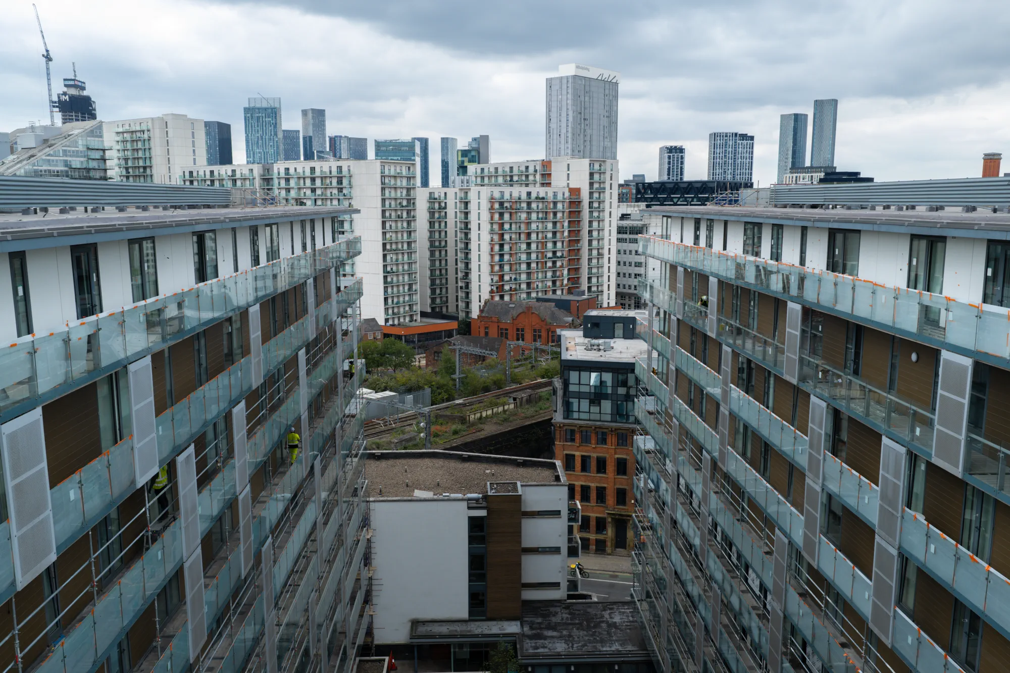 Aerial view between residential blocks showing balcony elevations at Spectrum Apartments in Salford