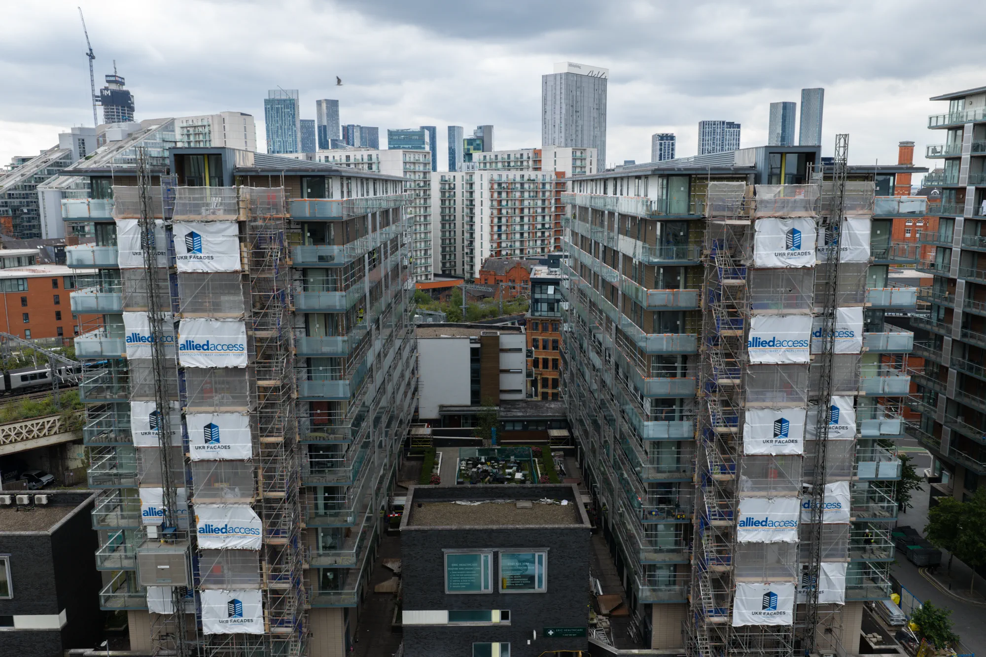 ukr-facades-spectrum-apartments-salford-project-aerial-18 Wide aerial view of external facade works across multiple residential blocks at Spectrum Apartments in Salford