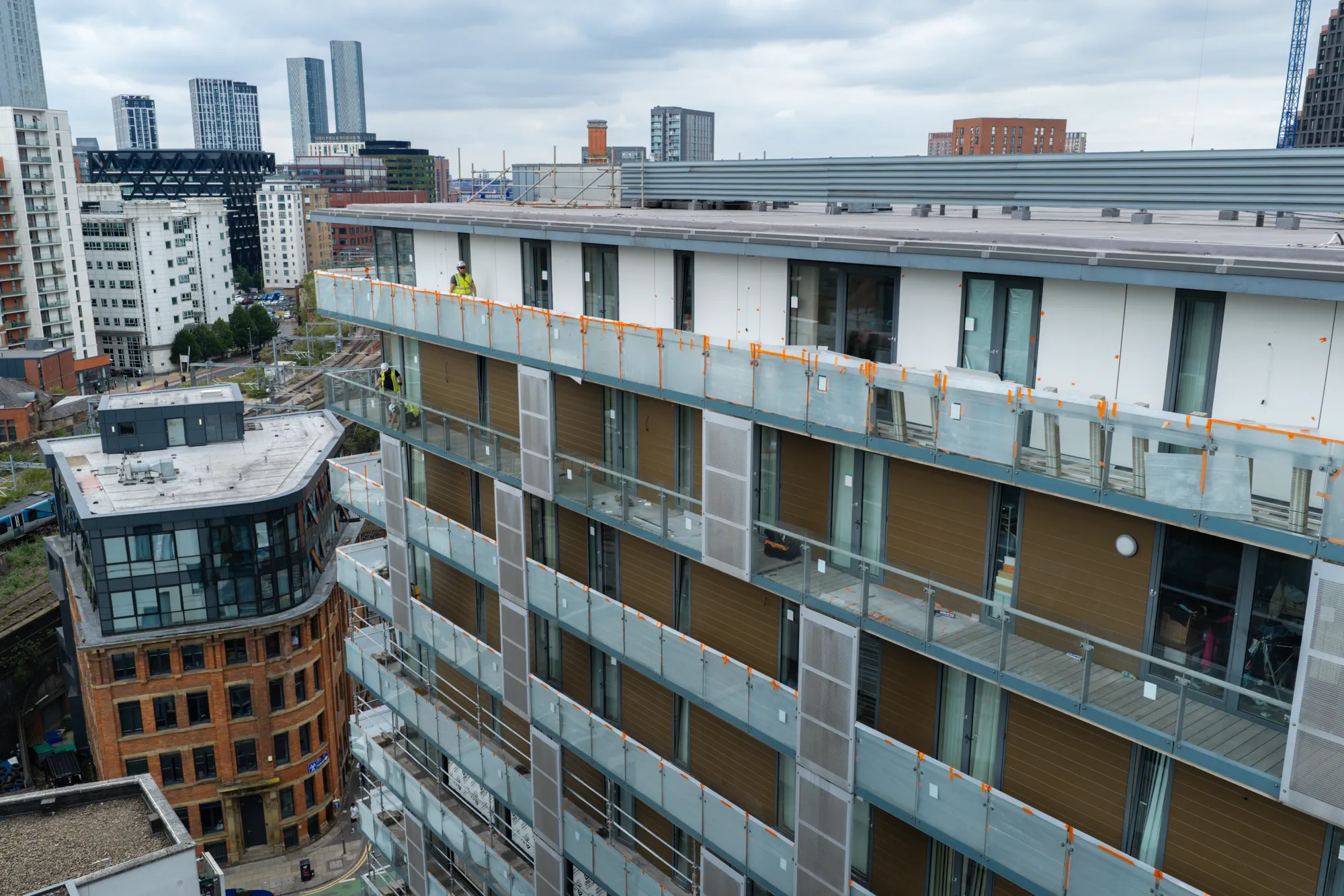 ukr-facades-spectrum-apartments-salford-project-aerial-8 Multi-storey balcony facade at Spectrum Apartments in Salford during external remediation works