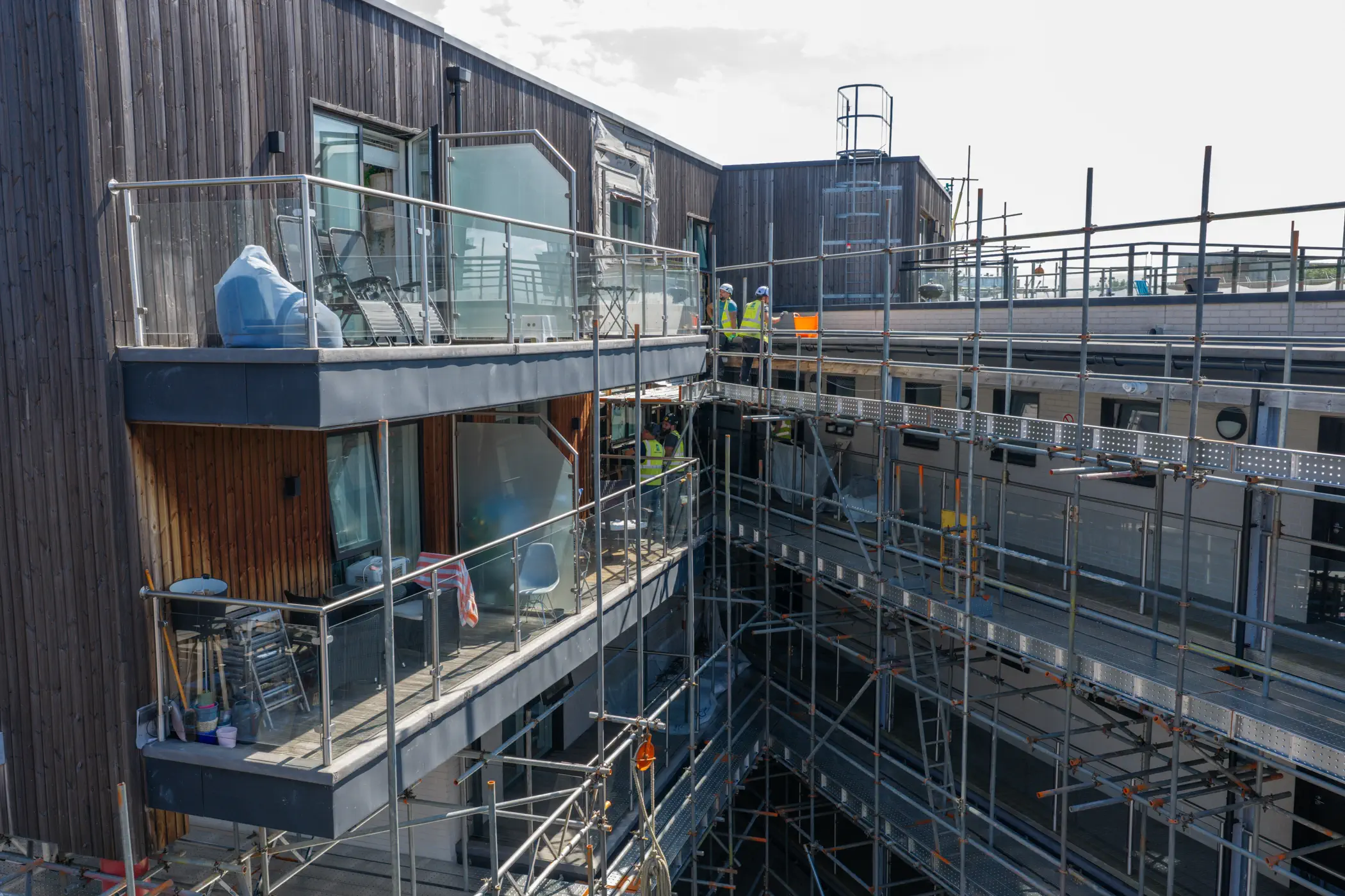 ukr-facades-the-central-london-project-aerial-12 Construction-stage view of scaffolding and external wall works across The Central residential facade in London