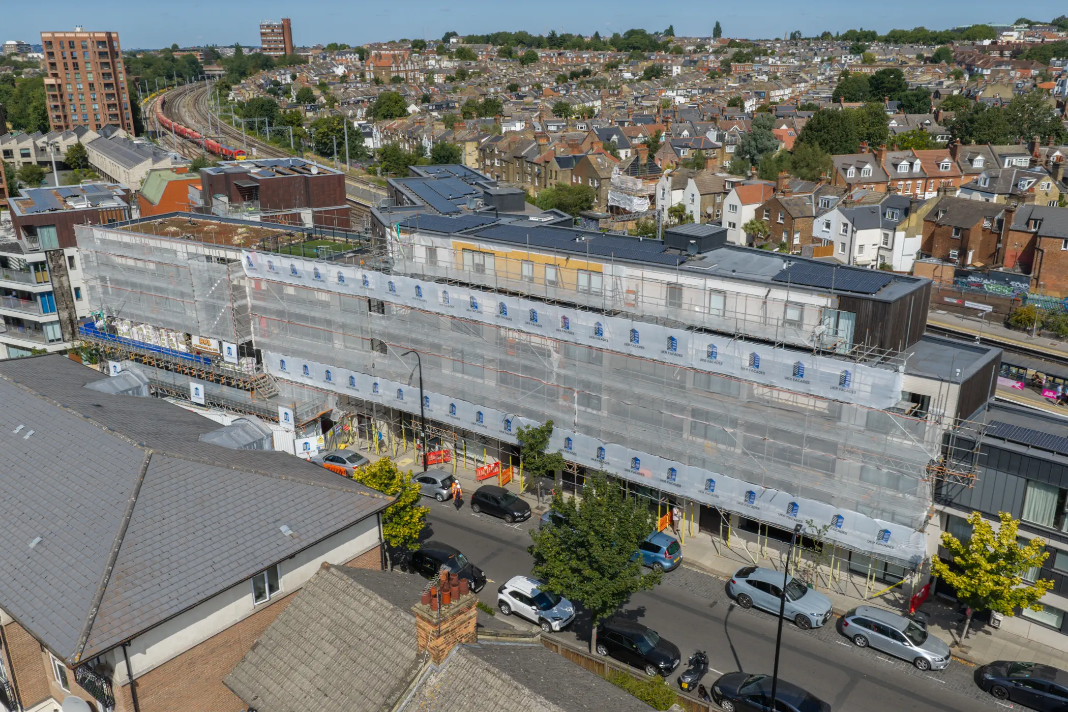 ukr-facades-the-central-london-project-aerial-4 Aerial view of The Central in London showing extensive external facade works across the residential elevation