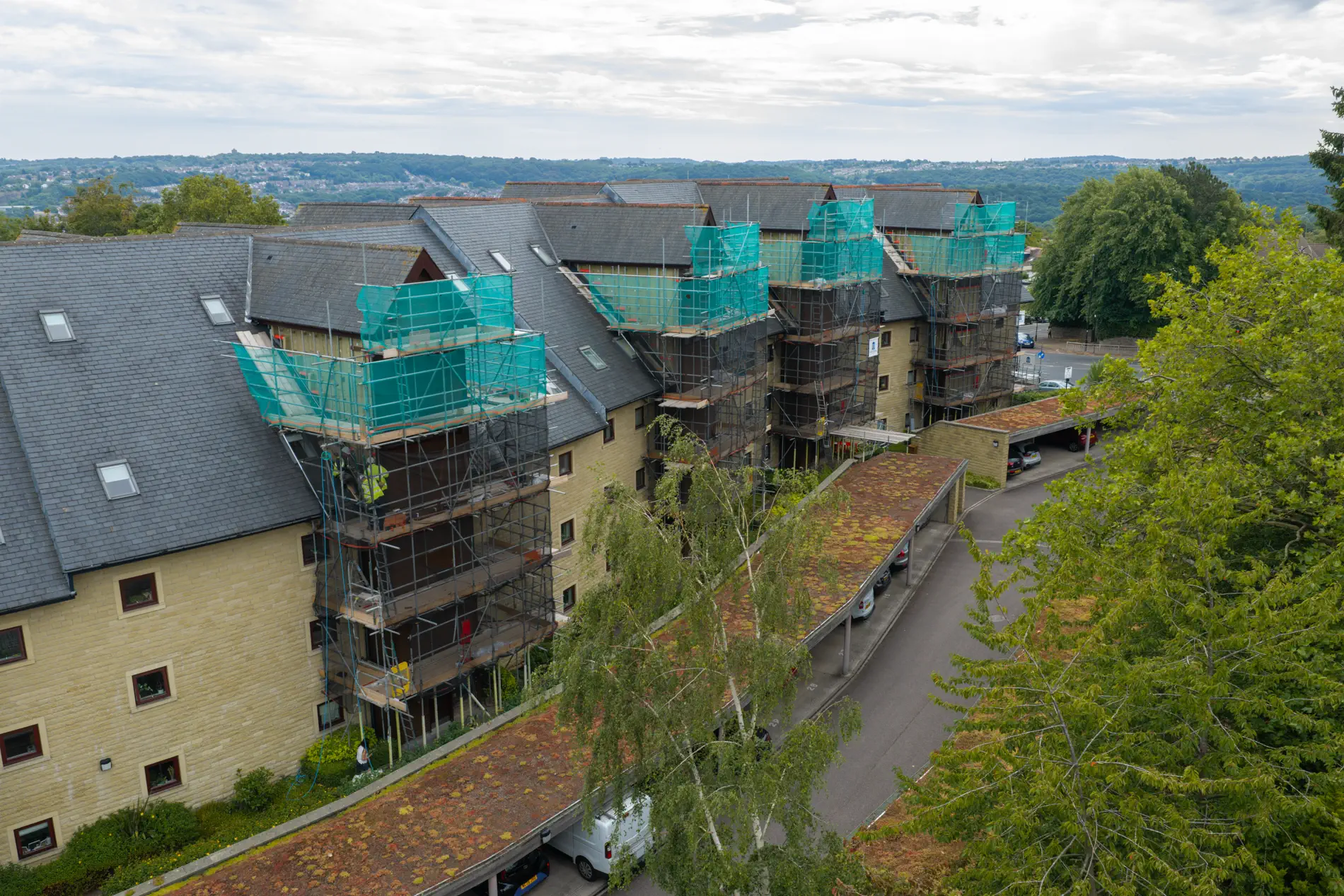 ukr-facades-westwood-gardens-sheffield-project-aerial-1 Aerial view of Weetwood Gardens in Sheffield showing scaffolding around the residential buildings