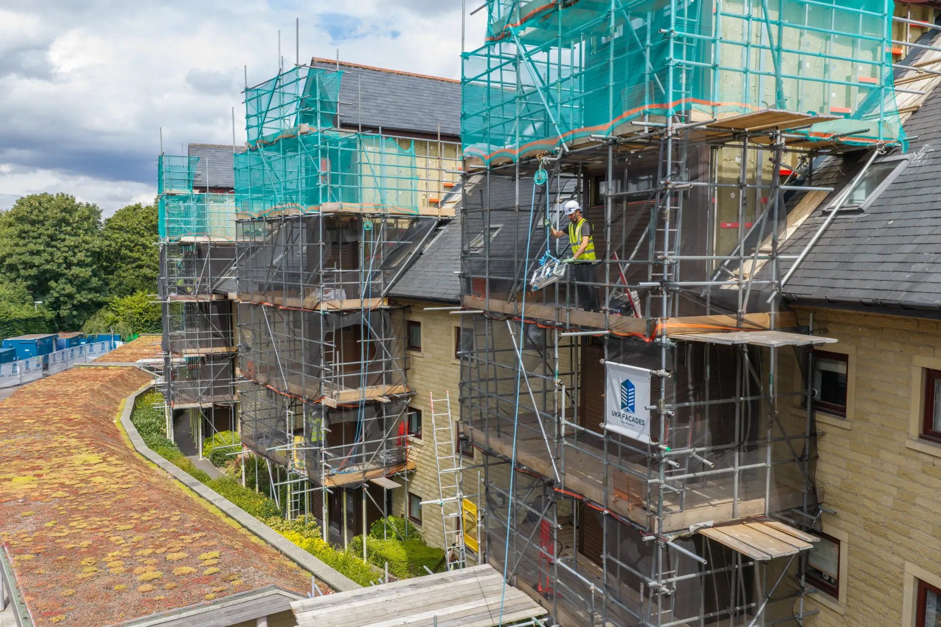 ukr-facades-westwood-gardens-sheffield-project-aerial-18 Scaffolding surrounding multiple residential elevations during external works at Weetwood Gardens in Sheffield