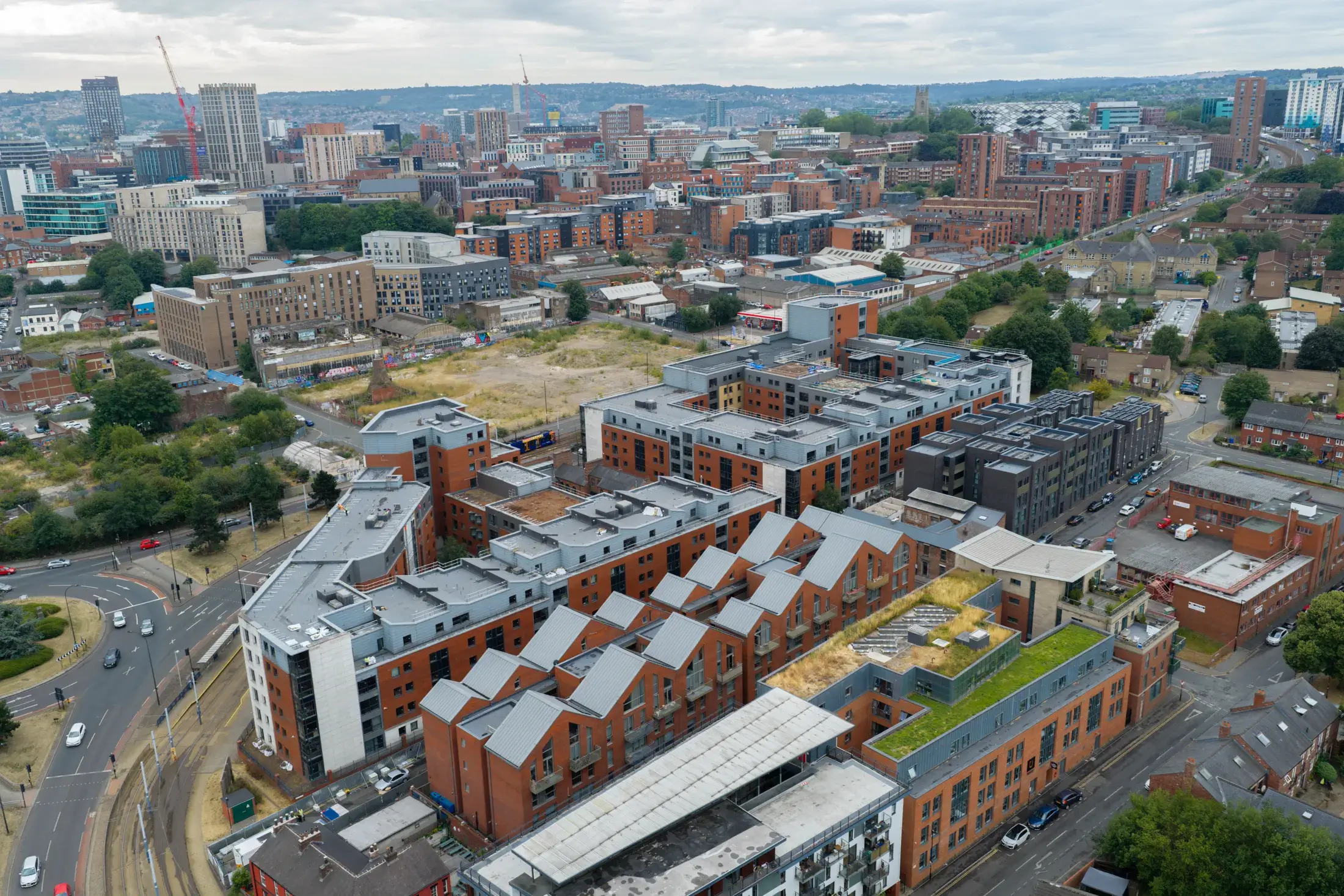UKR-Facades-Sheffield-3-Sheffield-04-08-26-Aerial-Construction-Services-49 Aerial view across Sheffield showing occupied residential and student accommodation developments served by UKR Facades