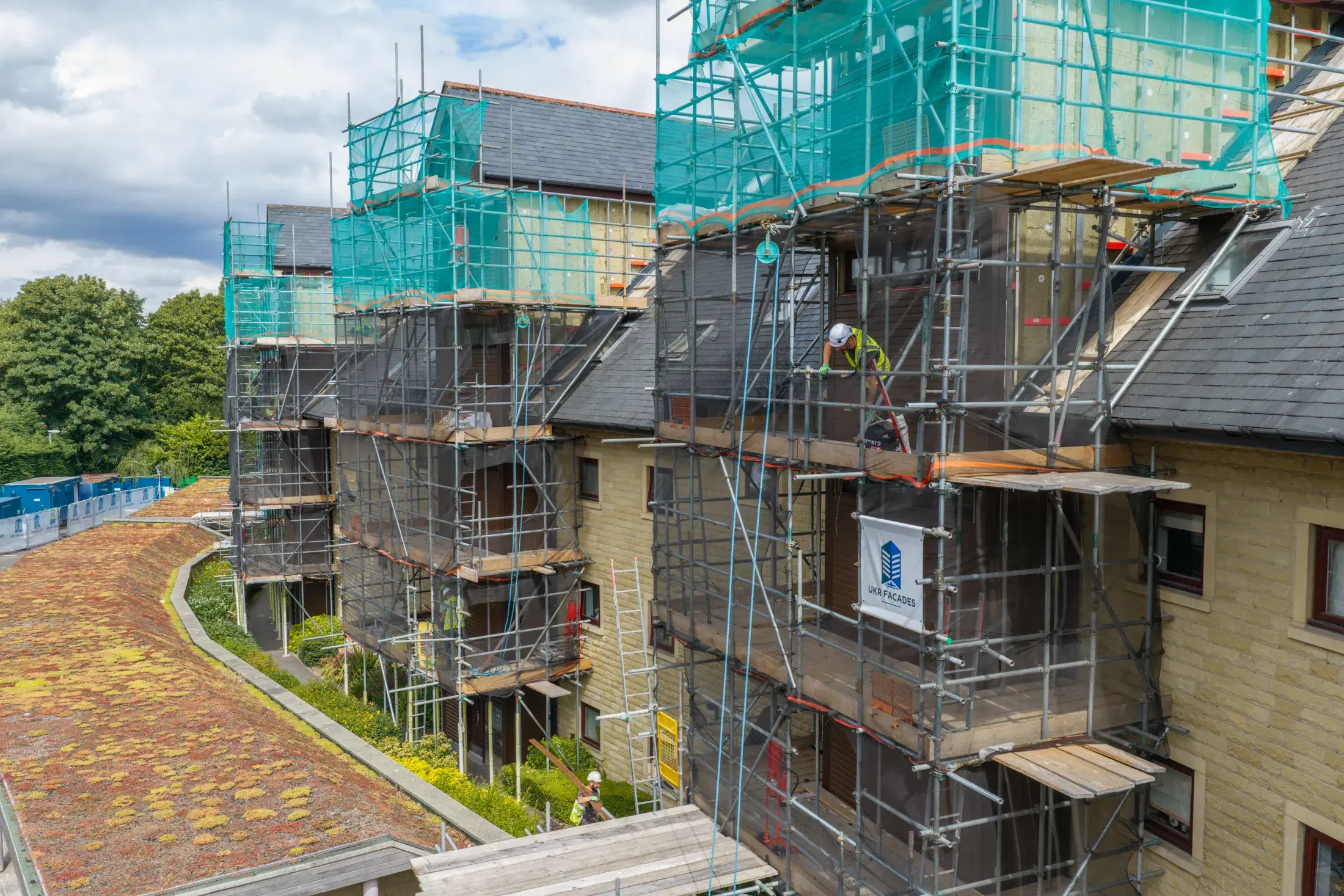 UKR-Facades-Weetwood-Gardens-Sheffield-04-08-26-Aerial-Construction-Services-71 UKR Facades remediation works underway at Weetwood Gardens in Sheffield with scaffolding and facade access