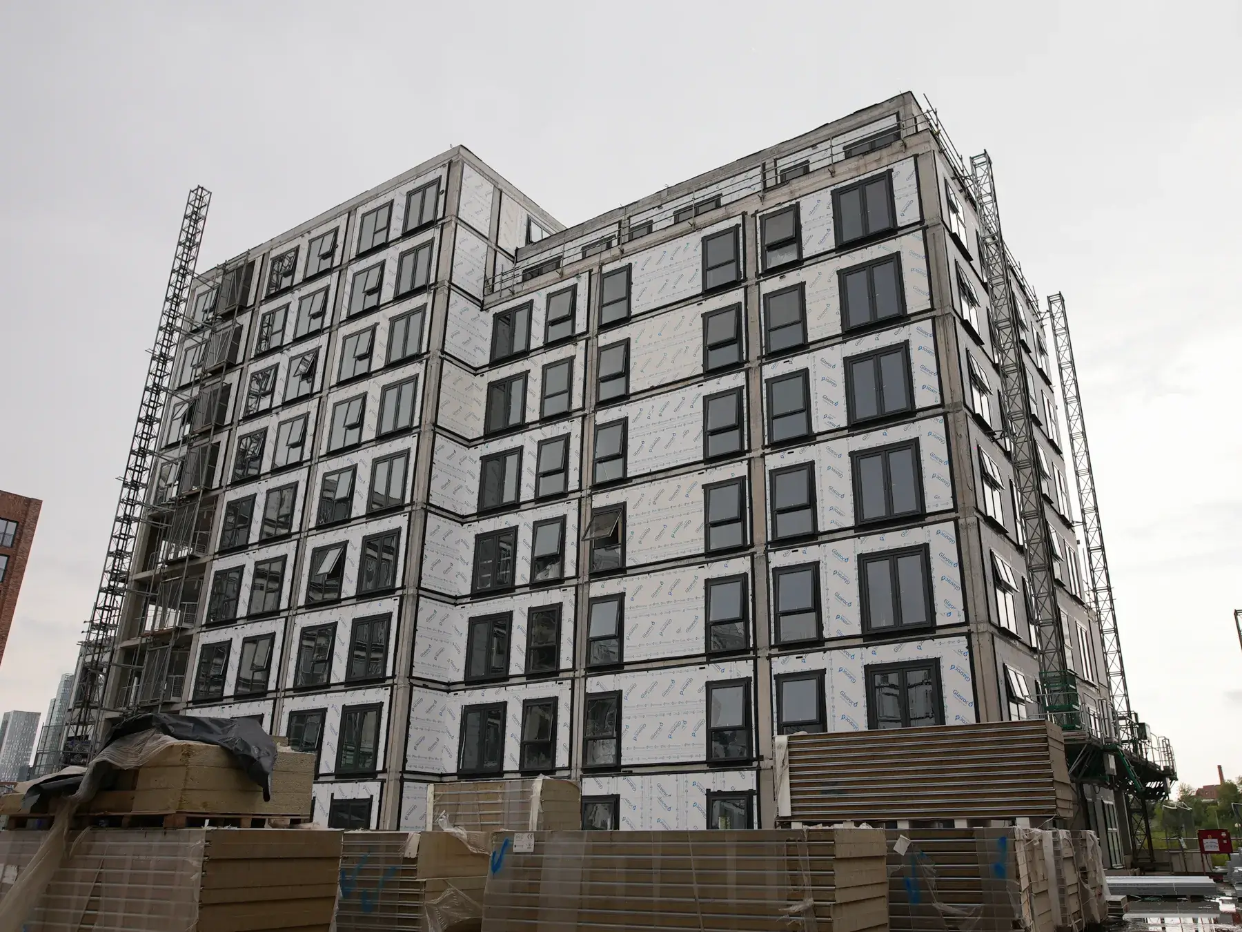 External wall construction and window installation at Bridgewater Wharf in Salford